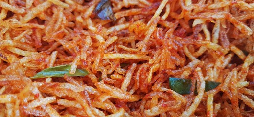 Kentang kering mustofa balado or dried crispy spicy potatoes is delicious traditional food from Indonesia