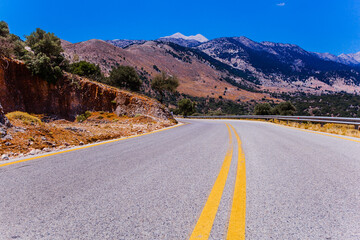 Empty scenic road between mountains on Crete island , Greece , 