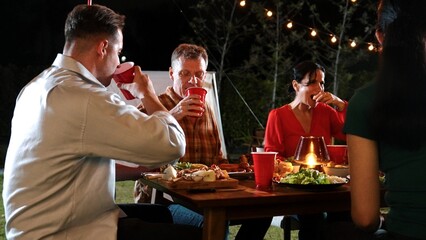 Family gather celebrate holiday. Focus father, grandmother and grandfather talk and have dinner...