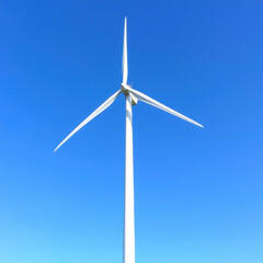 Modern wind turbine blades spinning against clear blue sky, showcasing renewable energy technology and sustainability. image captures essence of clean energy production