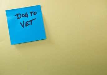 Sticky note reminder to take dog to the vet