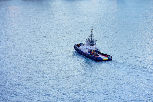 Aerial view of a tugboat sailing through blue waters, Singapore