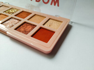 Eyeshadow
Women's grooming tools. Choice of eyeshadow colors on white background