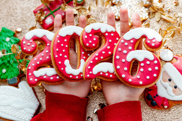 Christmas and New Year banner gingerbread cookies numbers 2026 on golden background