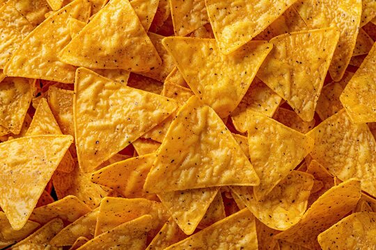 Background of nachos chips - Powered by Adobe