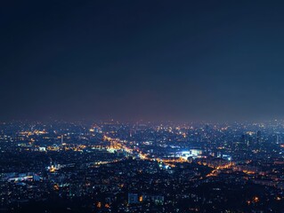 Fototapeta premium A stunning nighttime skyline view featuring a vibrant array of city lights illuminating the landscape.