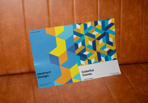 PSD template of a front and back cover of an open dossier on a leather sofa.