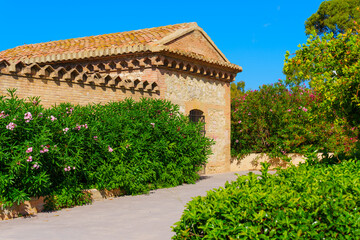 Naklejka premium Historic building with lush greenery in Valencia, Spain