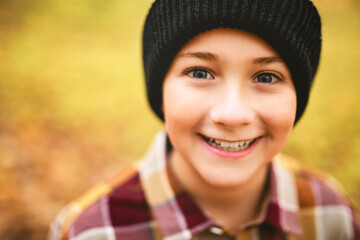 Child boy having fun on Autumn Forest