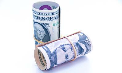 american money along with magnet, dice and compass. profit and loss. careful calculation