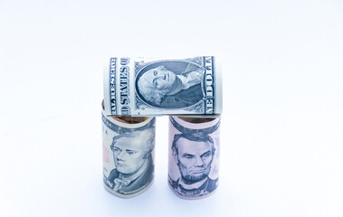 american money along with magnet, dice and compass. profit and loss. careful calculation