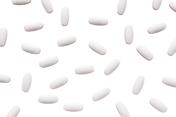 white pills scattered on a white background. medical preparations concept.