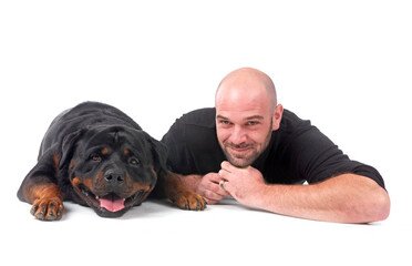 rottweiler and man in studio
