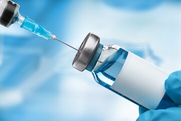Covid-19 vaccine vial with a syringe. RNA vaccines