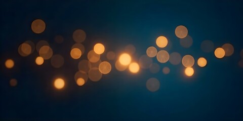 Blurred golden lights on a dark blue background.
