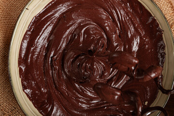 a bowl of chocolate dough , a whisk for a mixer, baking, structure and consistency, homemade, top view, no people,