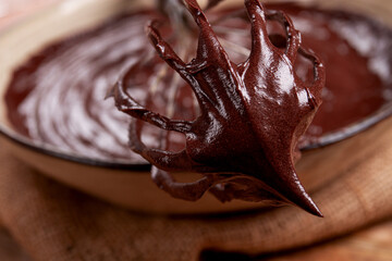 a bowl of chocolate dough, a whisk for whipping, baking, structure and consistency, homemade, top...