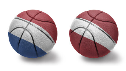 basketball balls with the national flags of latvia and netherlands on the white background.