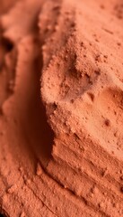 Close-up View of Rich Red Clay Showing Texture and Layers in Natural Light