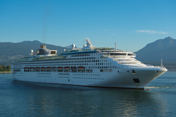 Cruiseship cruise ship liner P World arrival into Vancouver, BC port with scenic mountain glacier...