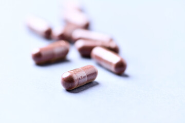 Lutein capsules. Dietary supplement on bright background. Soft focus. Close up. Copy space.