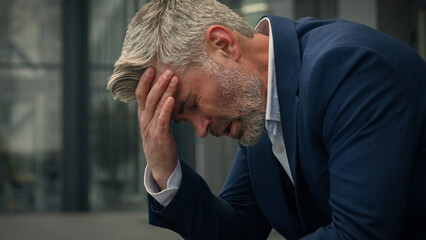 Caucasian old senior businessman feel bad unwell upset mature business man stressed middle-aged...