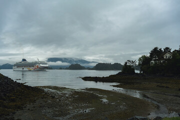 Modern family cruiseship cruise ship liner Sun anchoring in bay of Sitka, Alaska during Last...