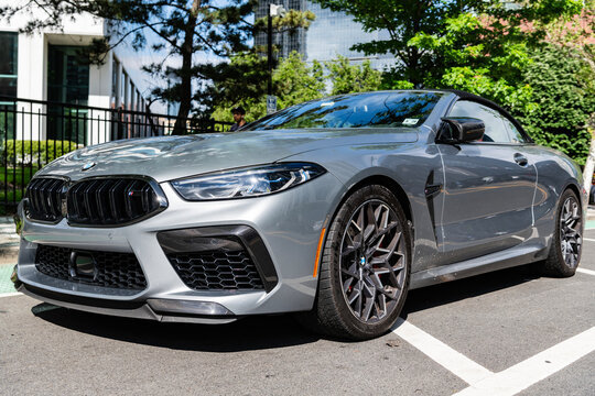New York City, USA - May 19, 2024: 2022 BMW M8 convertible car. Grey luxury BMW M8 convertible car parked outdoor. BMW M8 convertible, corner view