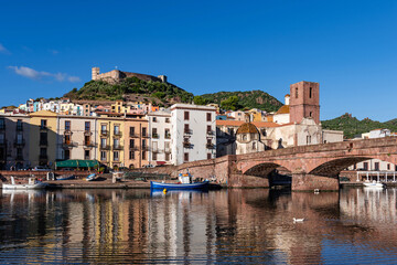 Panoramic view of the picturesque town of Bosa with its colorful houses reflected in the Temo...