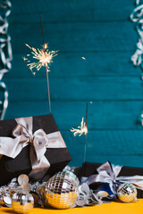 New Year's gifts with Christmas decorations and sparkler