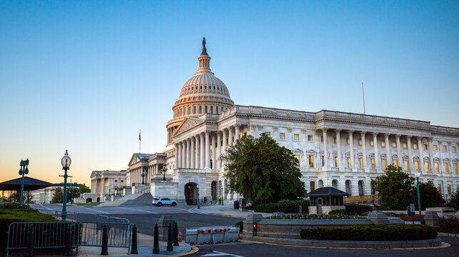 Security points in front of United States Capital Building that his home to Senate and House of Representatives as sunrise in fall in Washington D.C.
