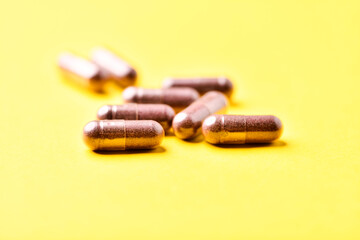 Lutein capsules. Dietary supplement on bright background. Soft focus. Close up. Copy space.