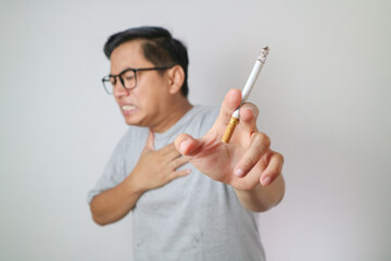 Adult Asian man got chest pain when smoking.