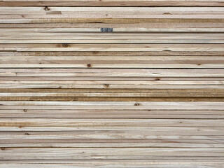 A large stack of wood planks