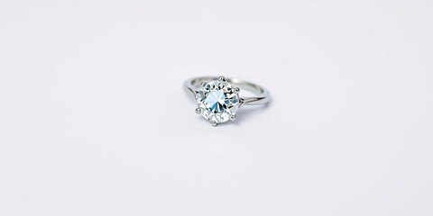 Diamond engagement ring lying on a crisp white background, love, rings, proposal