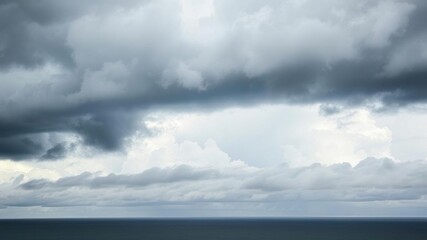 Fototapeta premium Storm cloud formations above Ordot Point, misty, thunderstorm, ocean