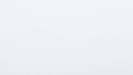 Close-up shot of a plain sheet of paper with subtle texture, highlighting its simplicity, matte, smooth, white