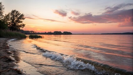 Obraz premium Soft focus photography of a serene lake scene with gentle waves lapping against the shore at sunset, calm waters, peaceful atmosphere, lake scenes