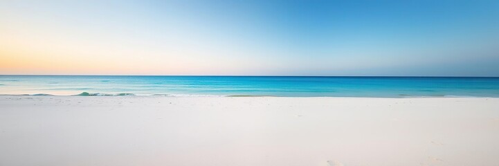Fototapeta premium Softly fading light on a pristine white sandy beach with an endless blue horizon, tranquility, natural
