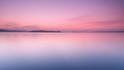 Fototapeta premium Soft focus image of a serene lake at dawn with soft purple and pink hues in the sky, natural scenery, sunrise, peaceful atmosphere