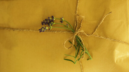 Background of a gift box made from eco paper decorated with lavender sprigs. 