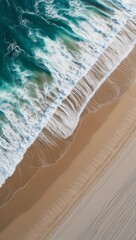 Top down aerial view of beach with waves crashing into the sand during day time. Travel and vacation concept copy space background