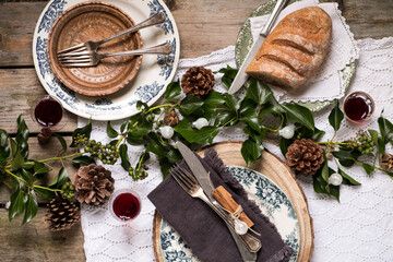 Festive Table Setting with Artisan Bread and Green Decor