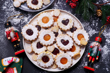 Traditional Christmas Linzer Cookies on a Christmas rustic background