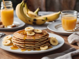 A plate of banana pancakes topped with slices of banana and honey, set on a cozy breakfast table.