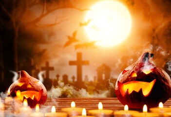 Halloween background with scary pumpkins and candles