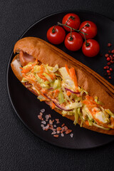Hotdog with grilled sausage with cabbage, carrots and onions
