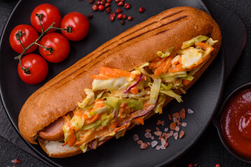Hotdog with grilled sausage with cabbage, carrots and onions