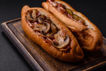 Hotdog with grilled sausage with bacon and mushrooms