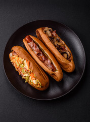 Hotdog with grilled sausage with cabbage, carrots and onions